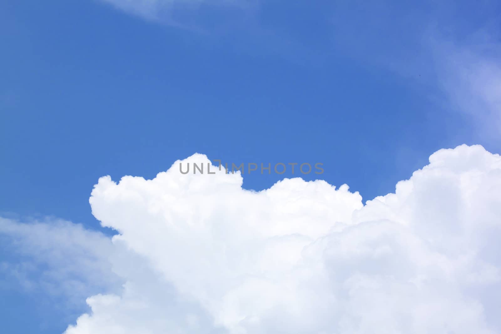 White fluffy clouds in the blue sky