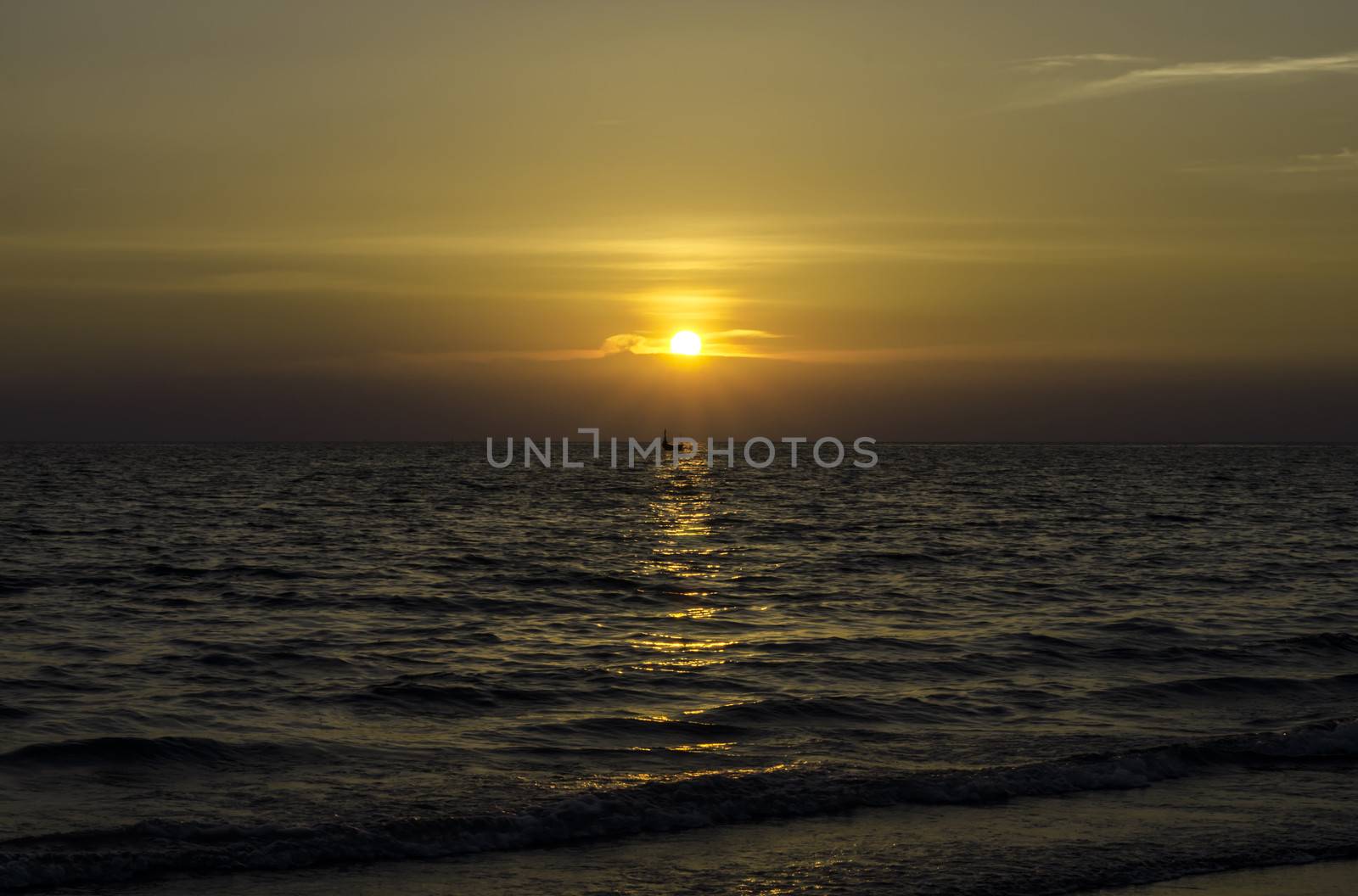 Yellow Sun Set in The Middle of The Ocean and very very small boat