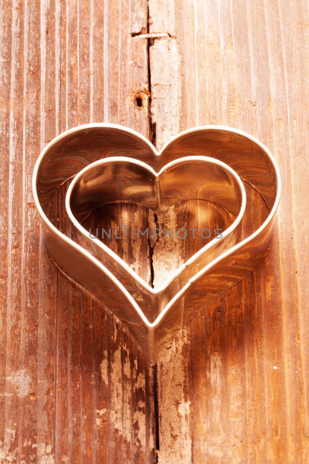Cookies cutter heart on wood