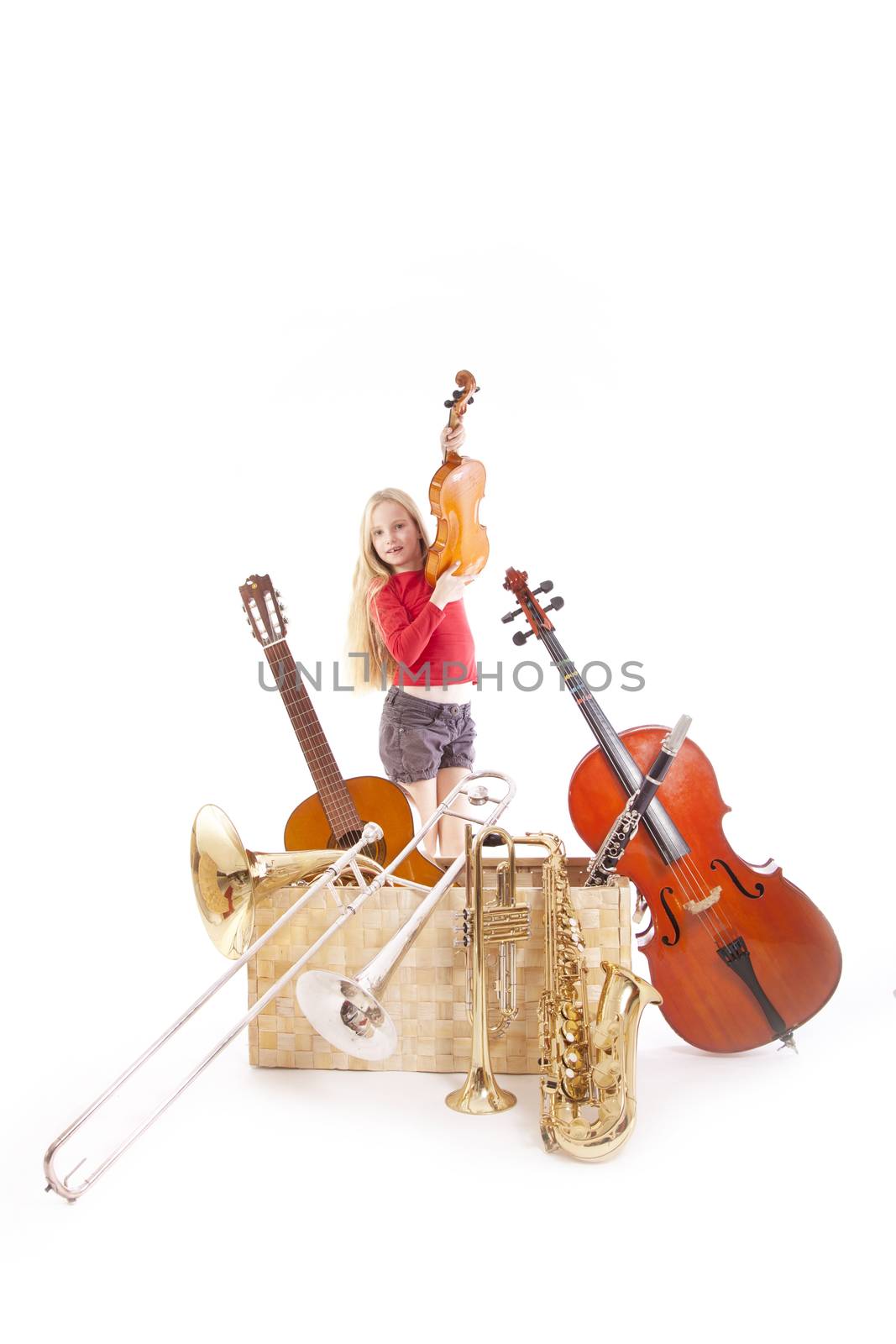 young girl with many musical instruments in box by ahavelaar