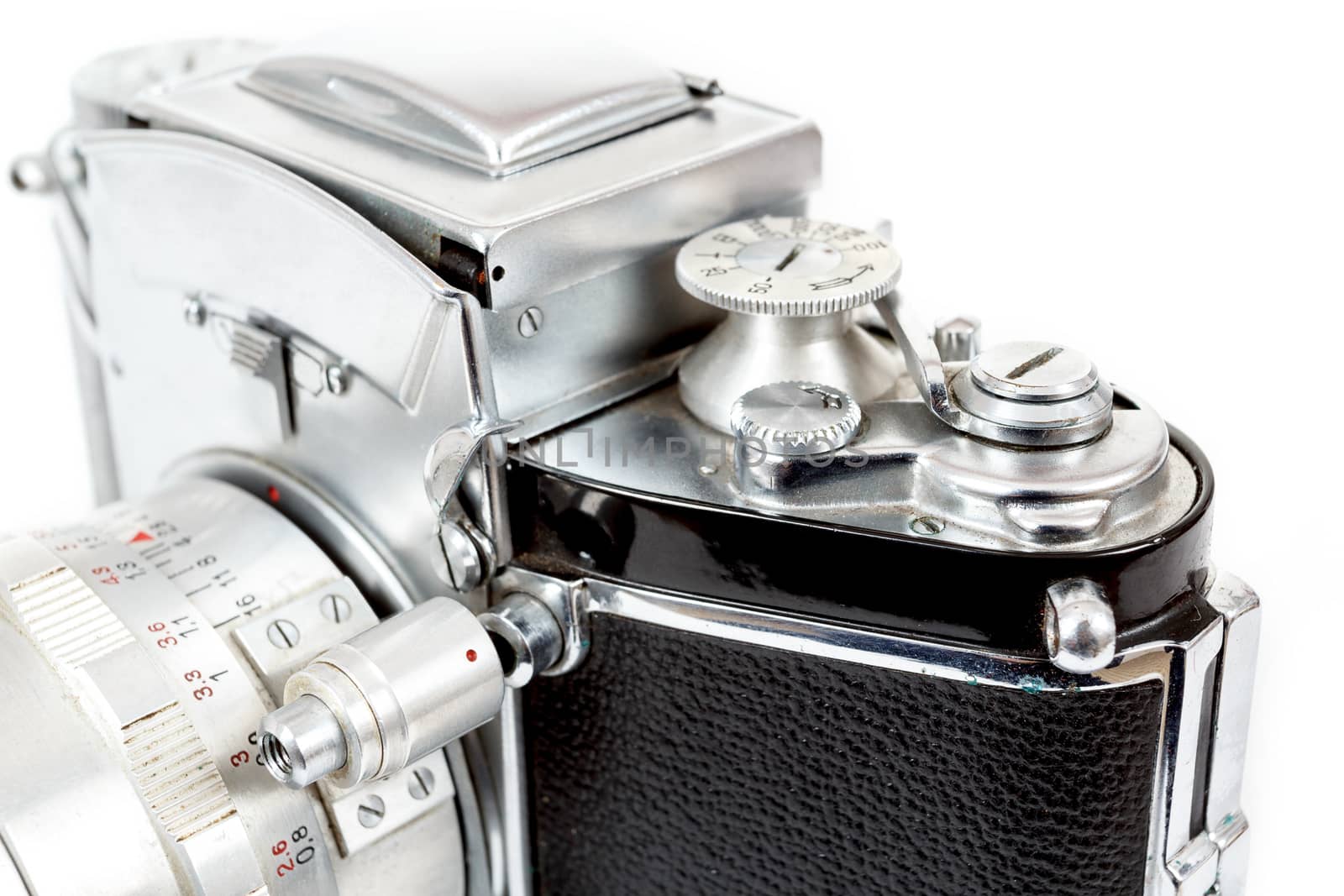 detail view of retro old vintage analog photo camera on white background view from the side
