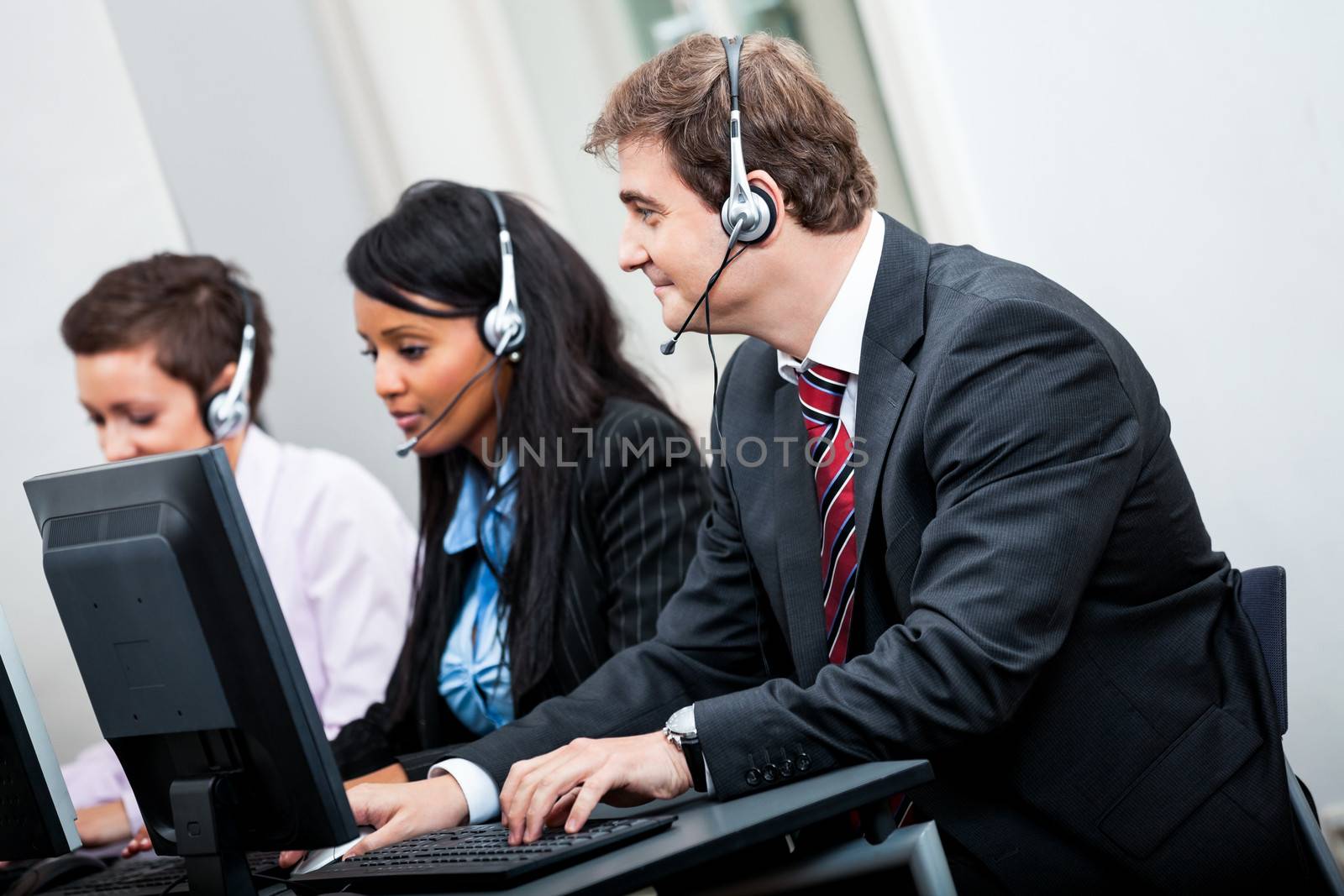 smiling callcenter agent with headset support by juniart