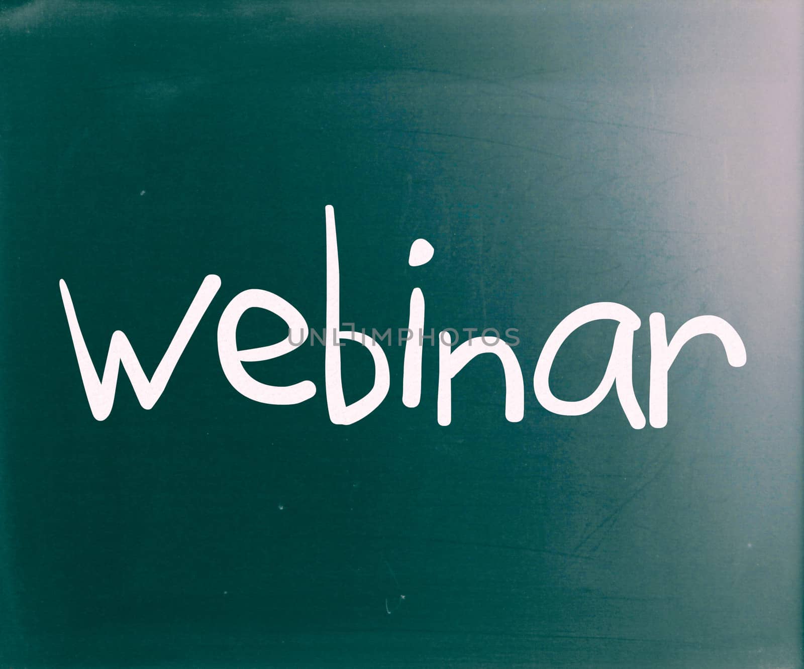 The word "Webinar" handwritten with white chalk on a blackboard