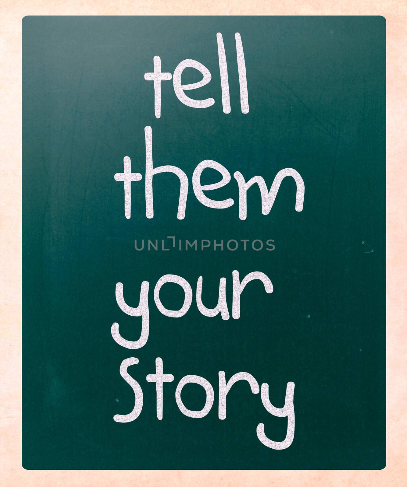 "Tell them your story" handwritten with white chalk on a blackboard