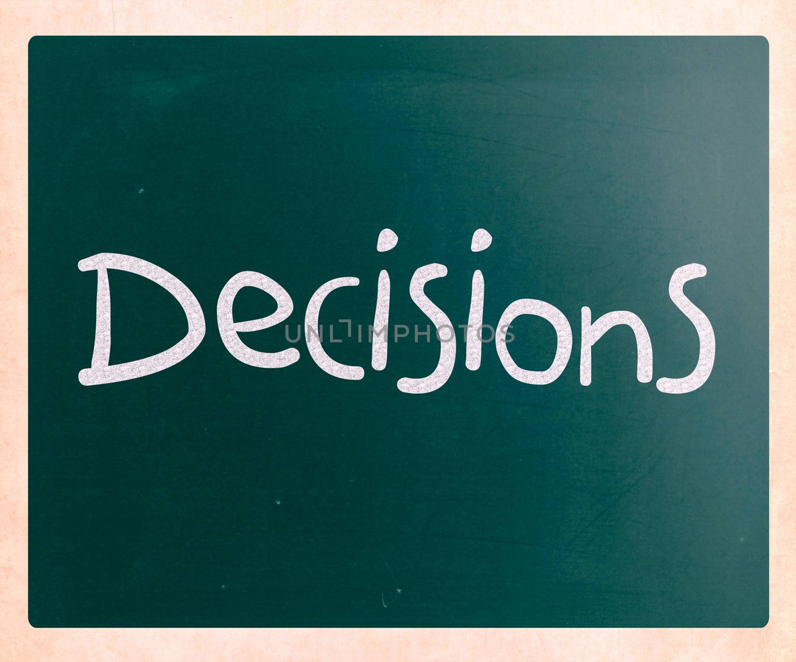 The word "Decisions" handwritten with white chalk on a blackboard