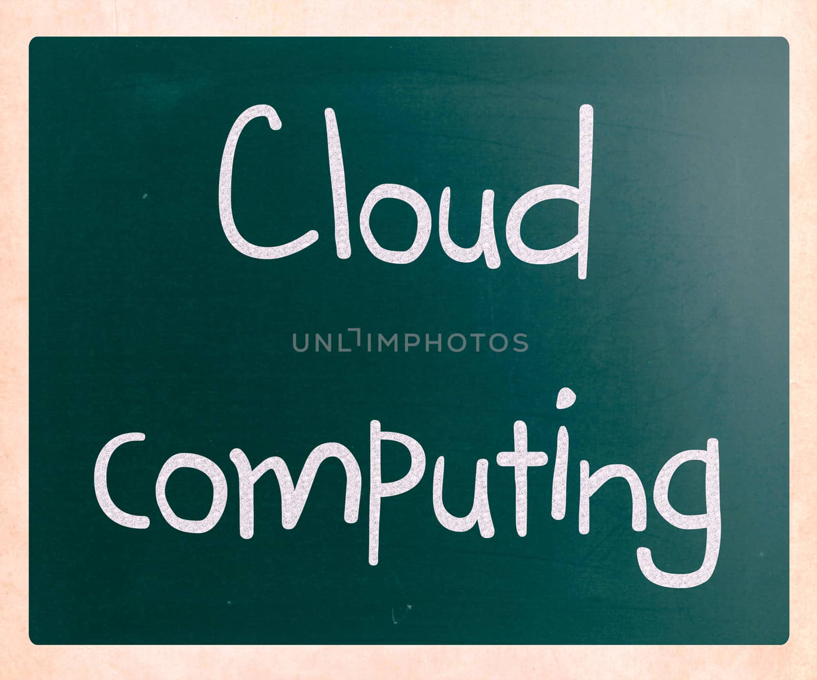 "Cloud computing" handwritten with white chalk on a blackboard