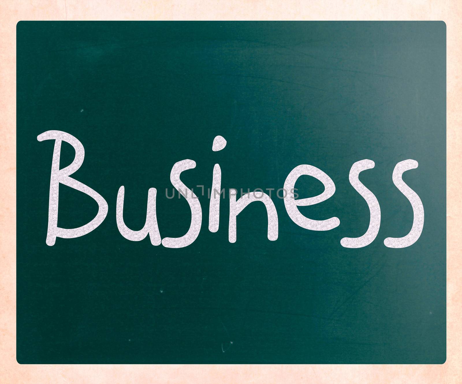 The word "Business" handwritten with white chalk on a blackboard