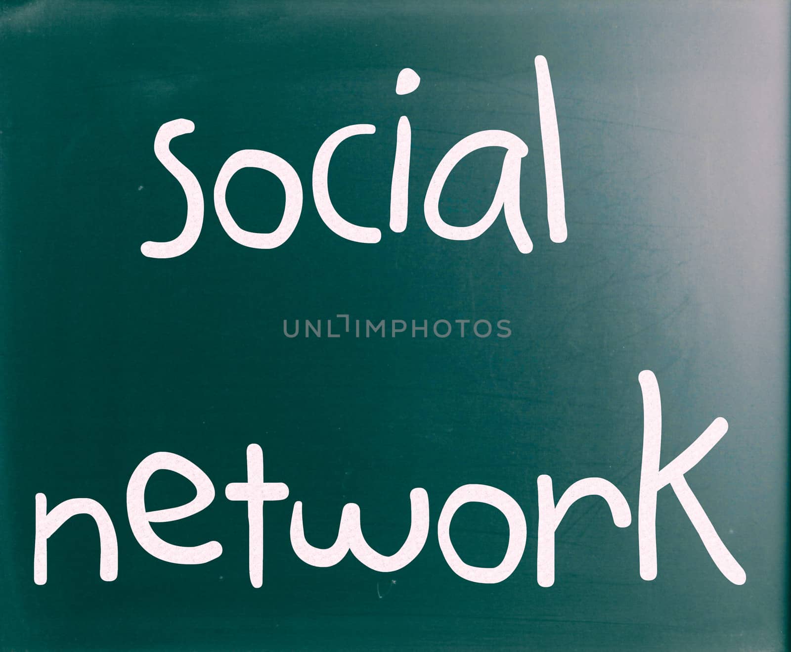 The word "Social network" handwritten with white chalk on a blac by nenov