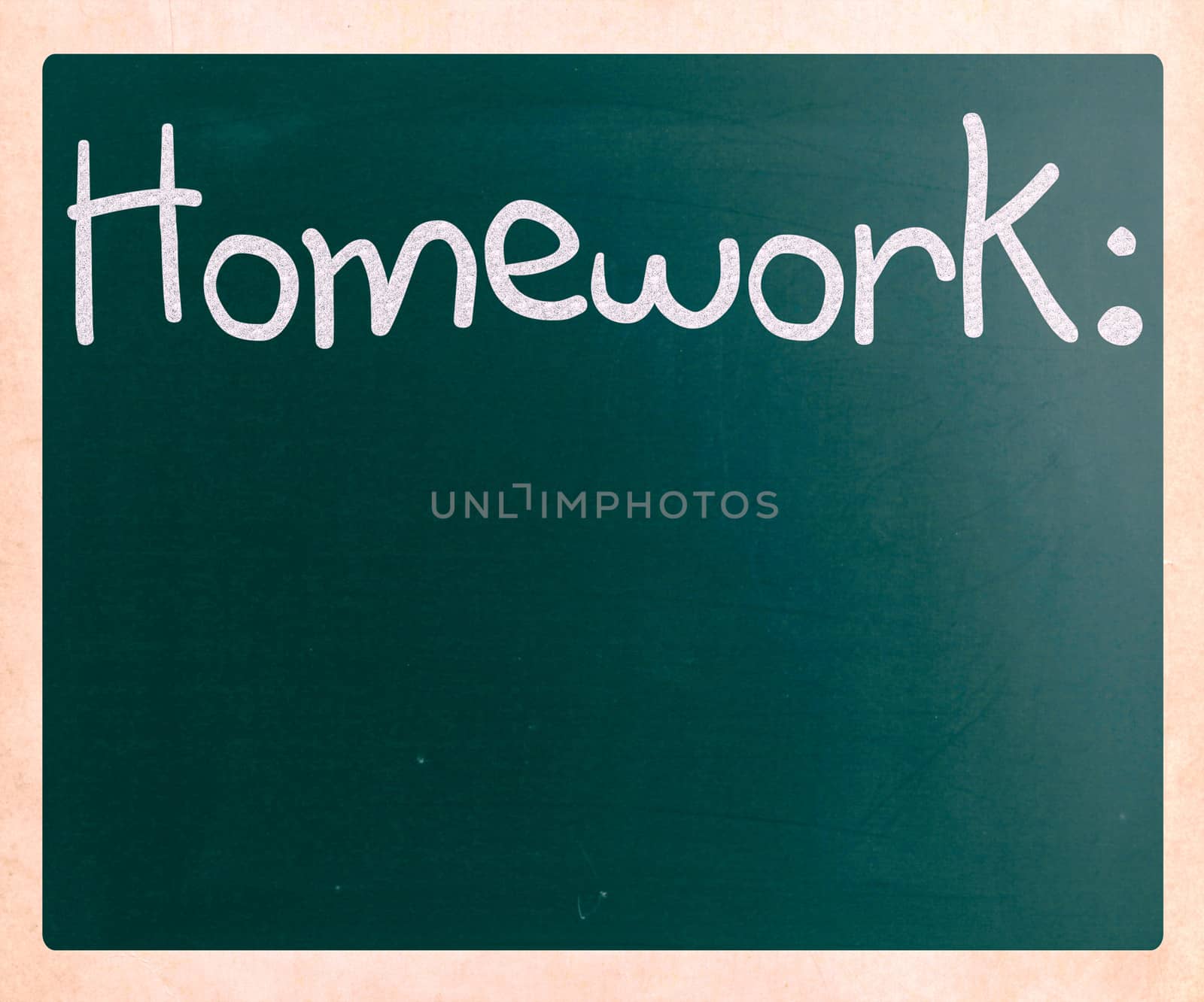 "Homework" handwritten with white chalk on a blackboard