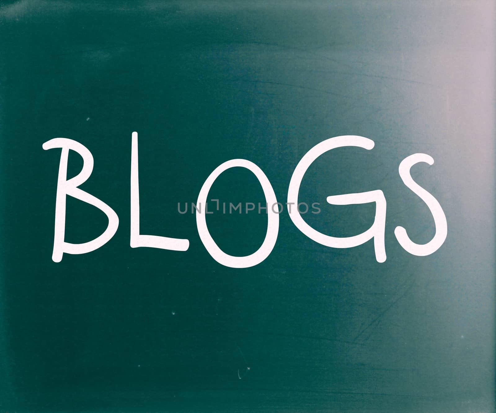 "Blogs" handwritten with white chalk on a blackboard