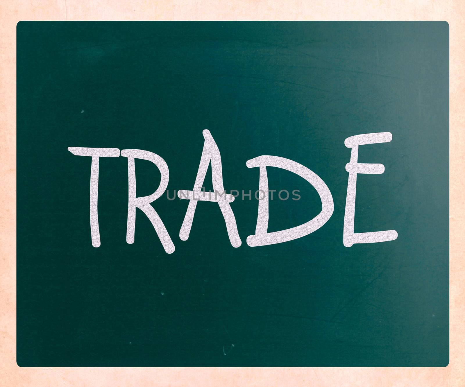 "Trade" handwritten with white chalk on a blackboard