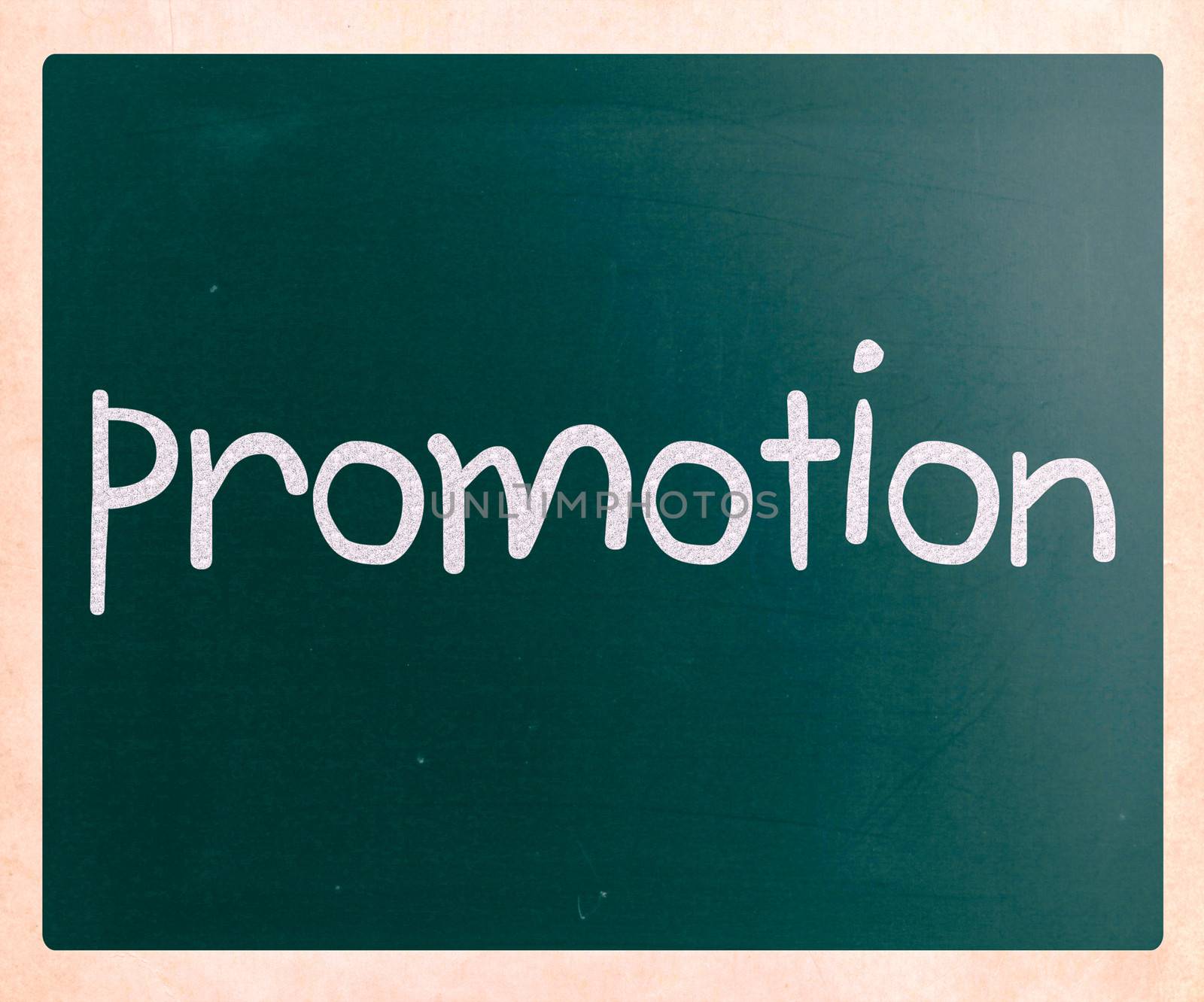 The word "promotion" handwritten with white chalk on a blackboard