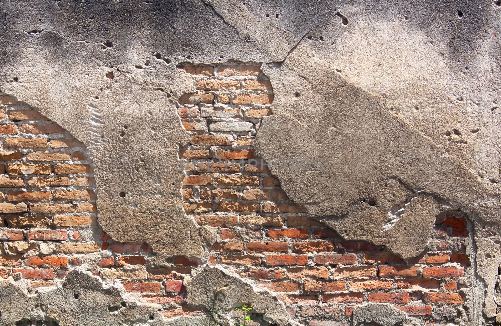 Decayed, cracked concrete vintage brick wall background.