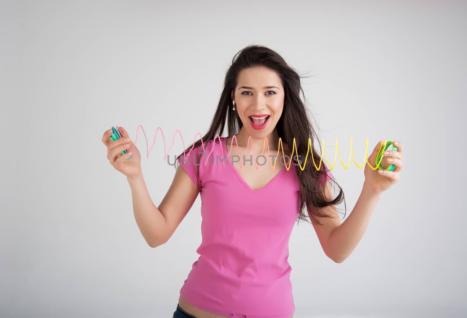 beautiful woman with a toy rainbow
