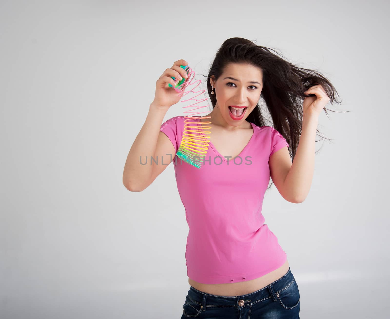 beautiful woman with a toy rainbow