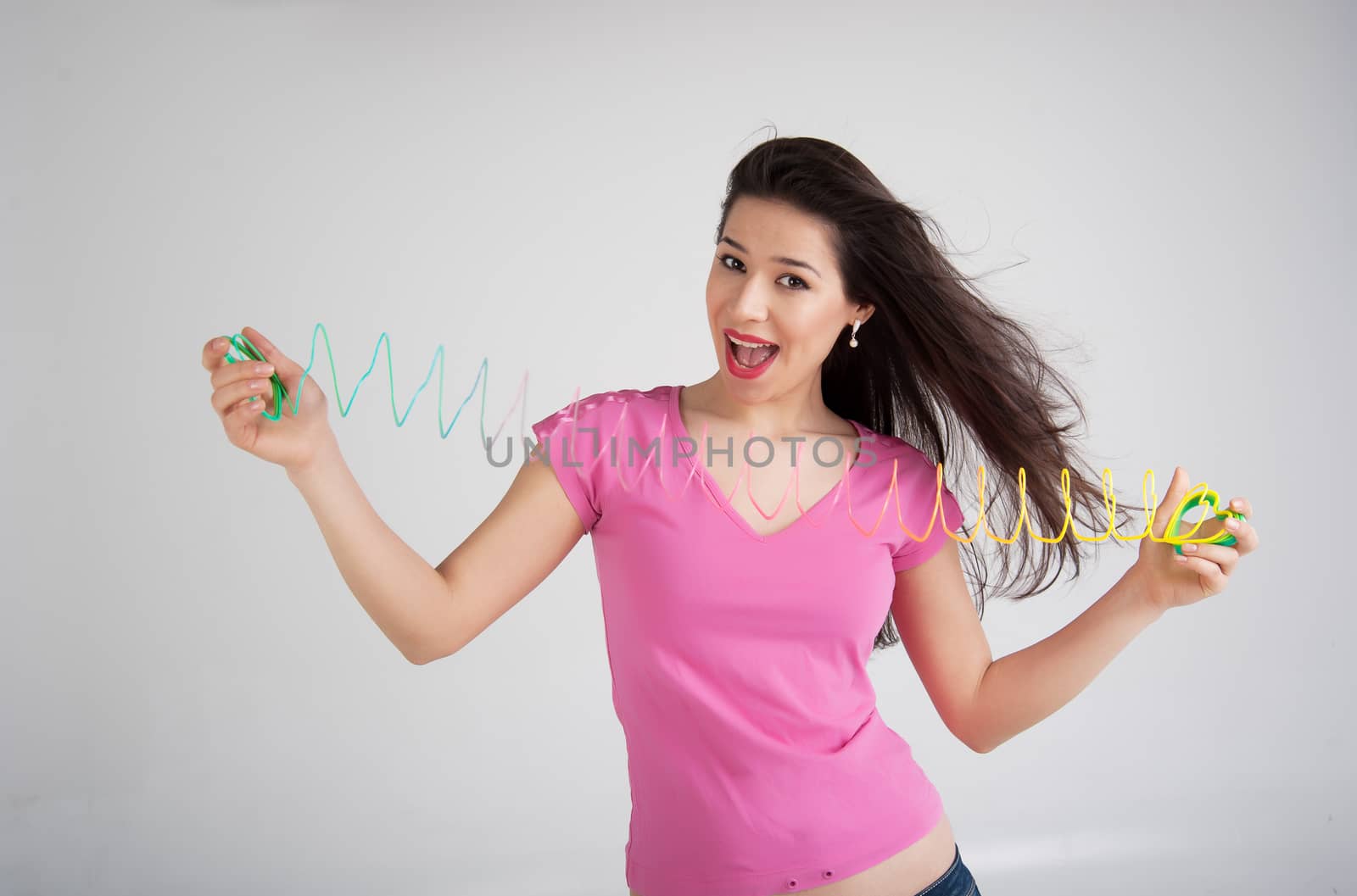 beautiful woman with a toy rainbow
