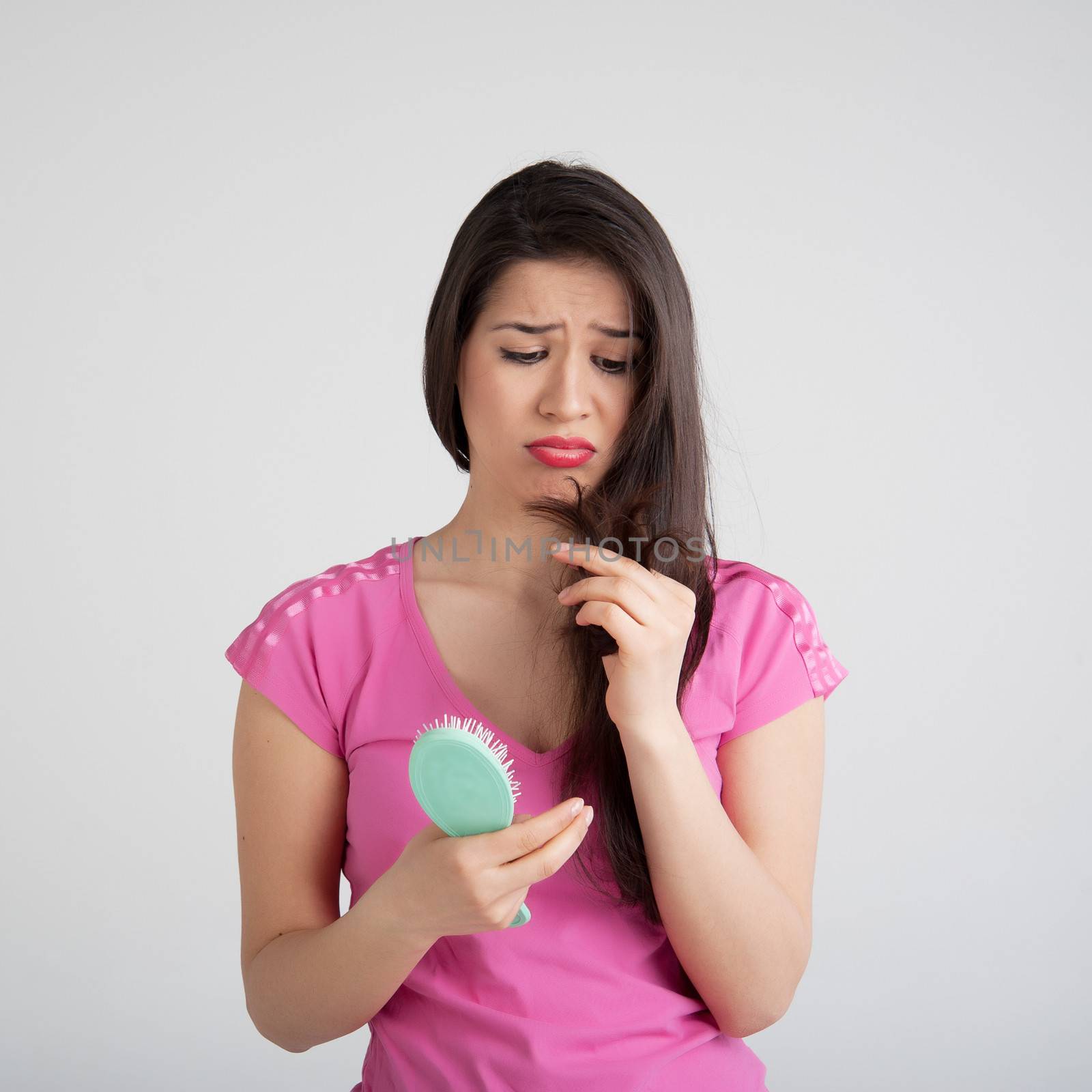 shocked woman losing hair on hairbrush by raduga21