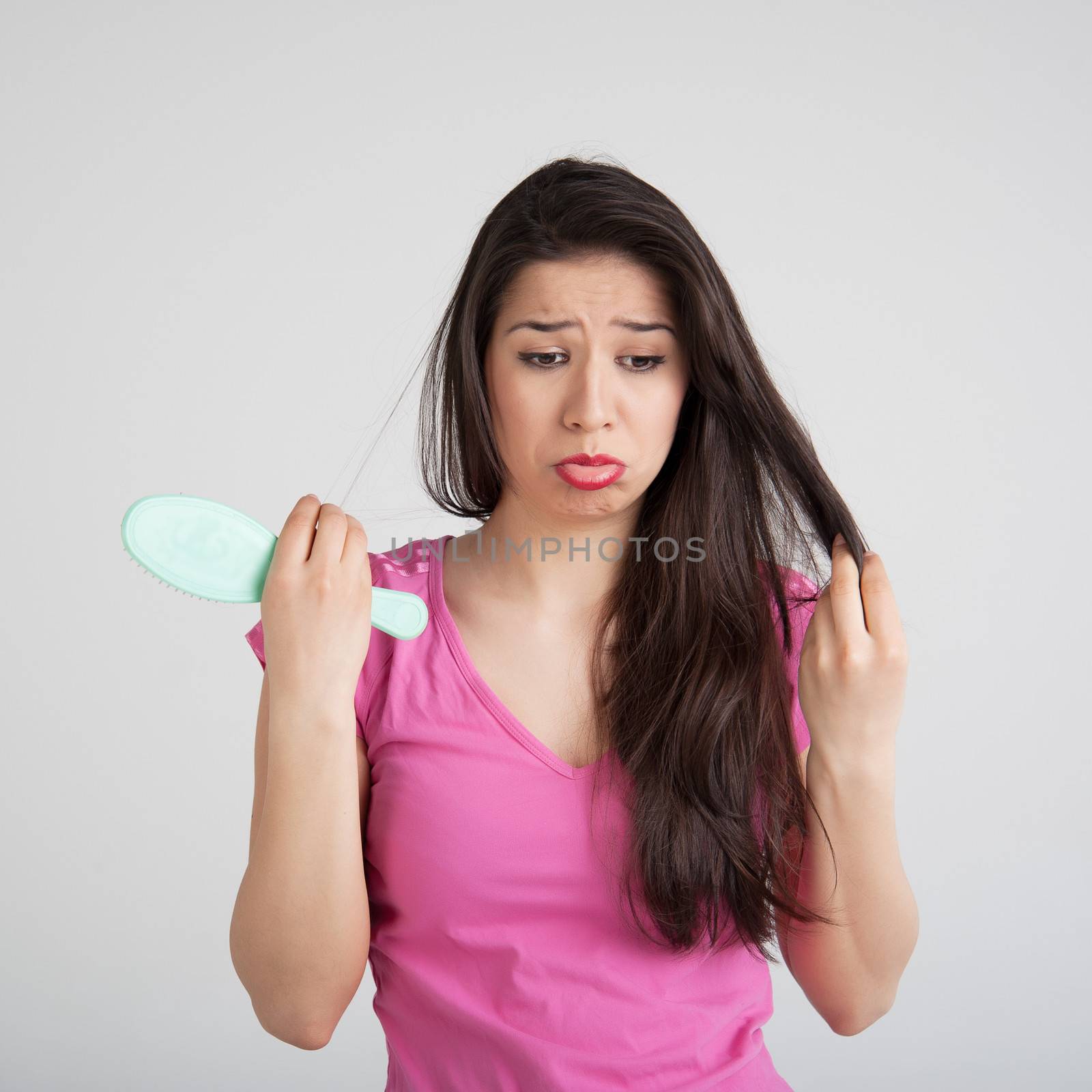 shocked woman losing hair on hairbrush by raduga21