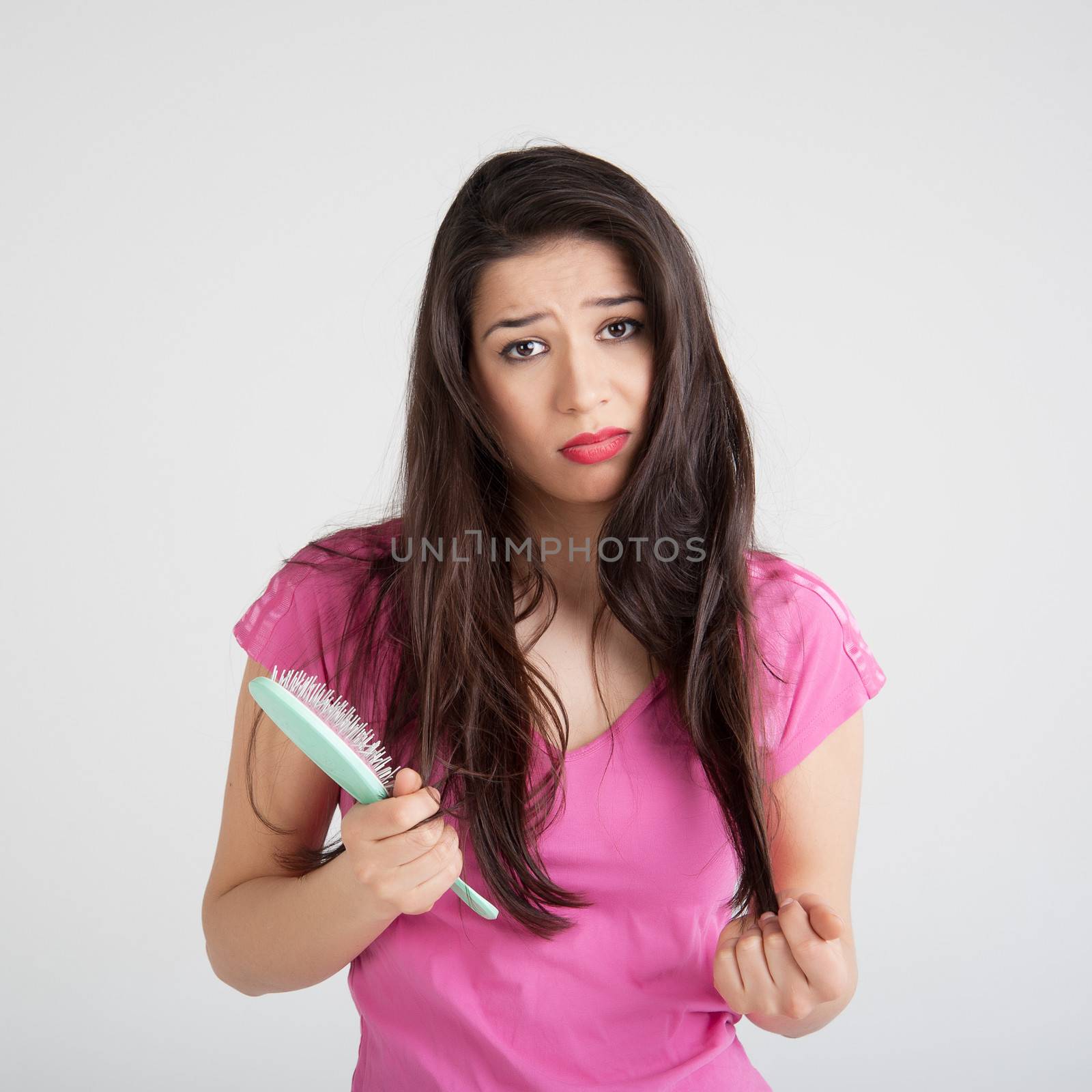 shocked woman losing hair on hairbrush by raduga21