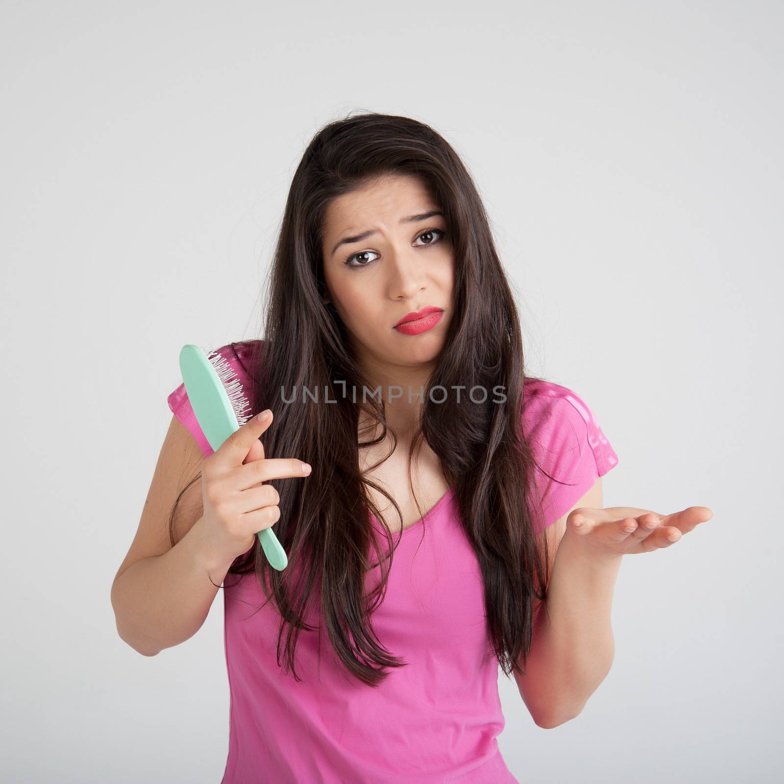 shocked woman losing hair on hairbrush by raduga21