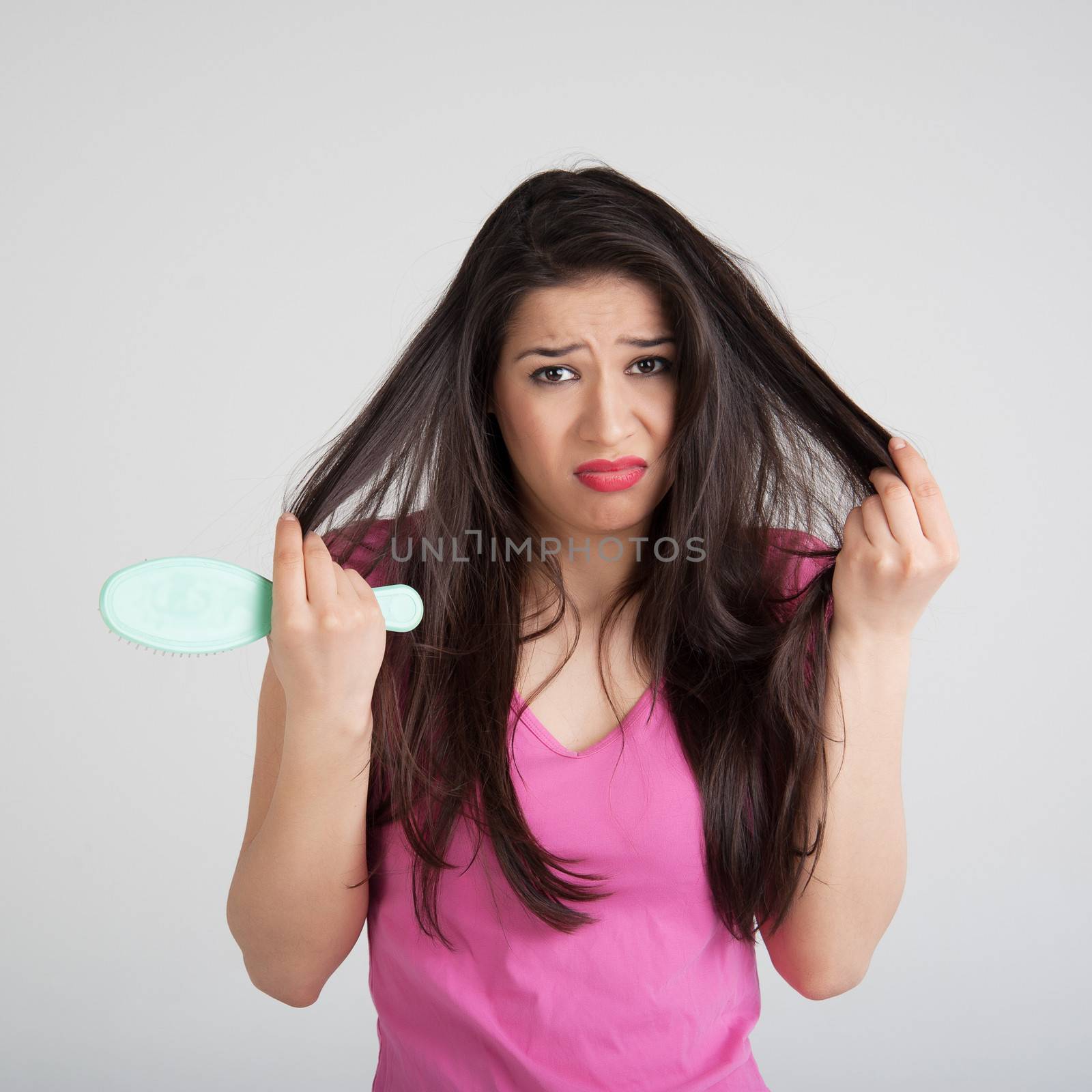 shocked woman losing hair on hairbrush by raduga21