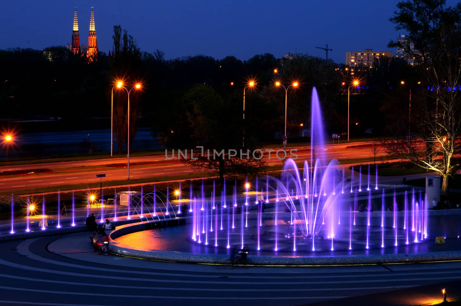 Warsaw landmark - illuminated fountain at night. Poland