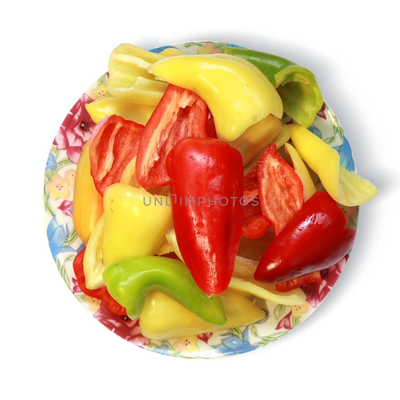 bell peppers on plate isolated on white background with path