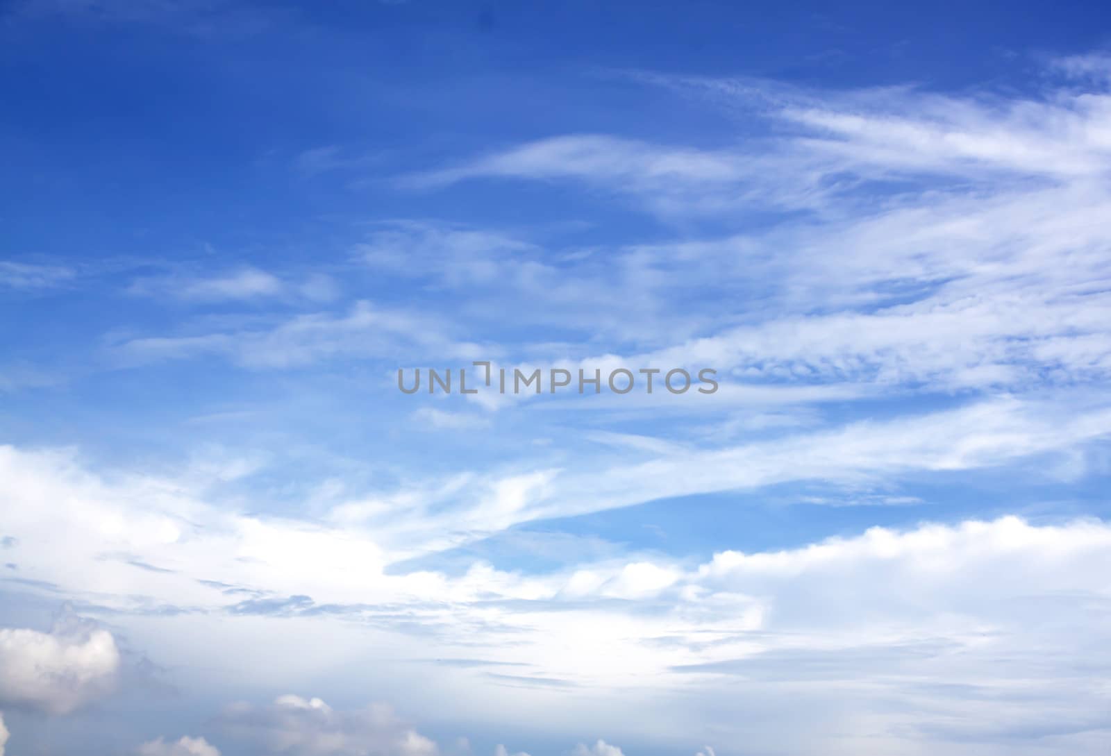 White fluffy clouds in the blue sky by janniwet