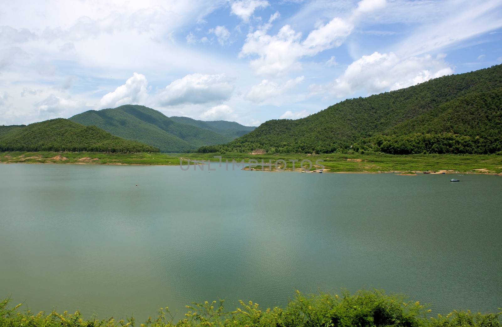 Natural forest landscape mountains sky water clouds.