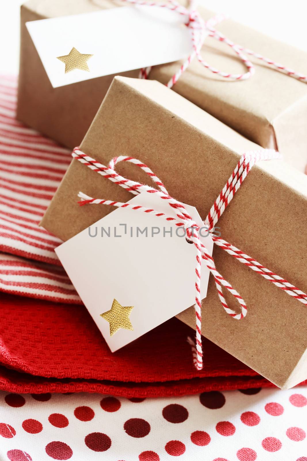 Handmade present boxes with tags on red napkins