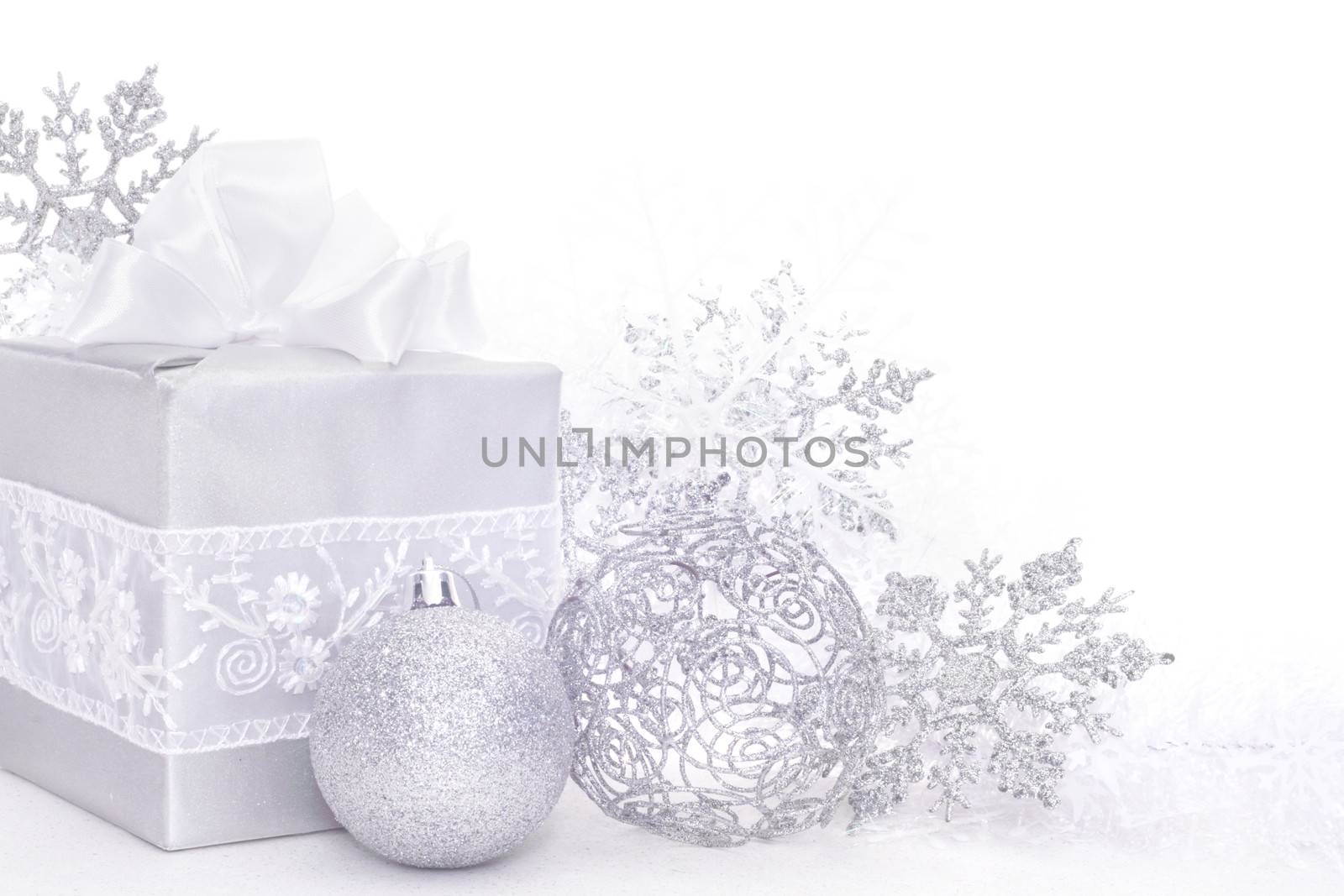 Christmas card with silver gift and decoration on white