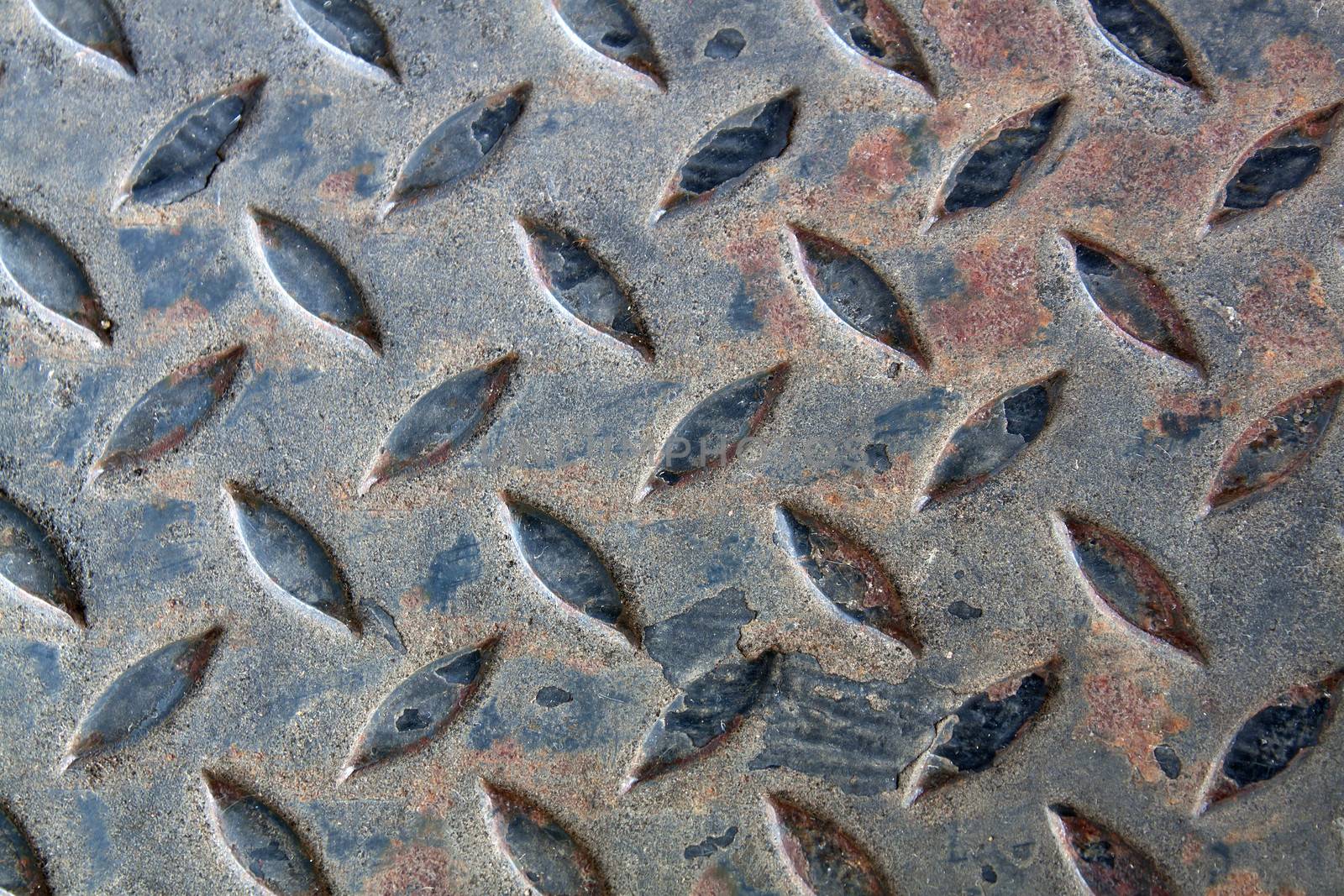 Old rusty metal plate to prevent slipping.