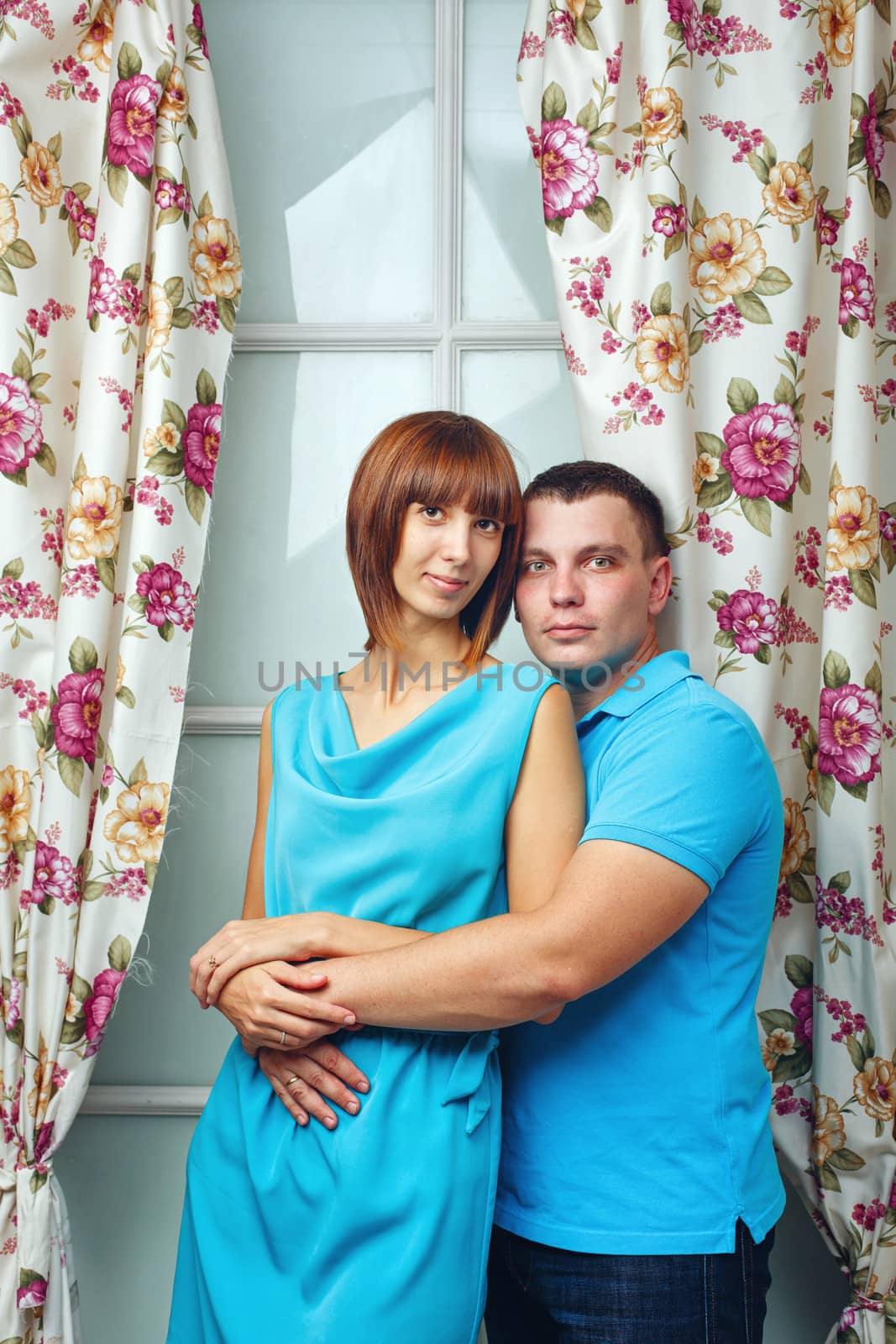 Man and woman embracing in a studio shot