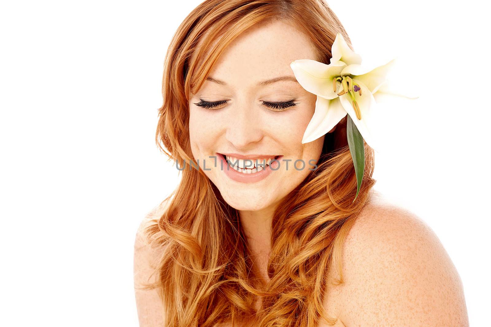 Charming young woman with white lily flower