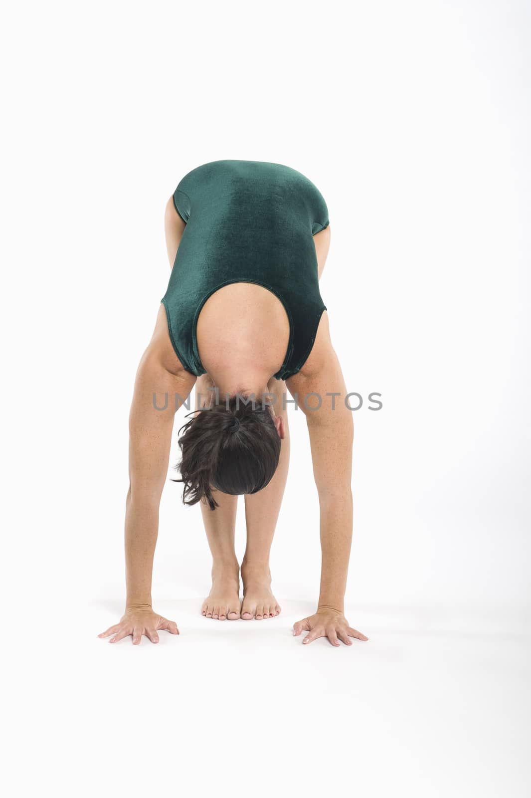 Woman in yoga position by moodboard