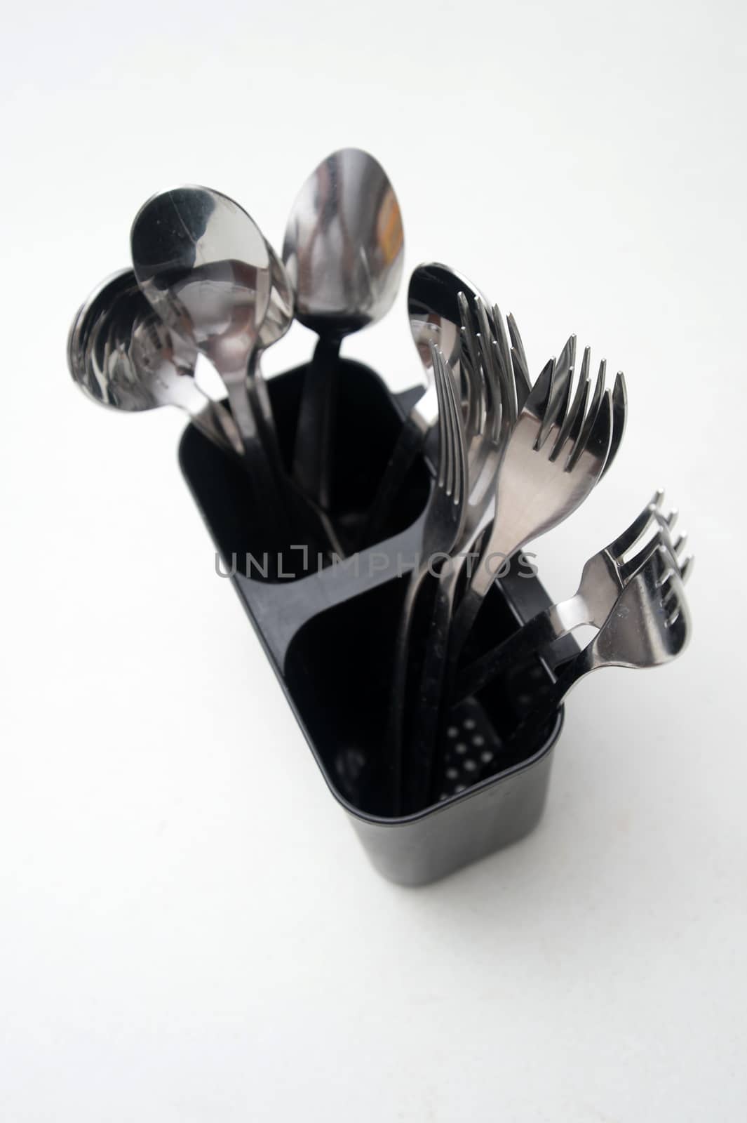 Silver cutlery isolated on a kitchen bench