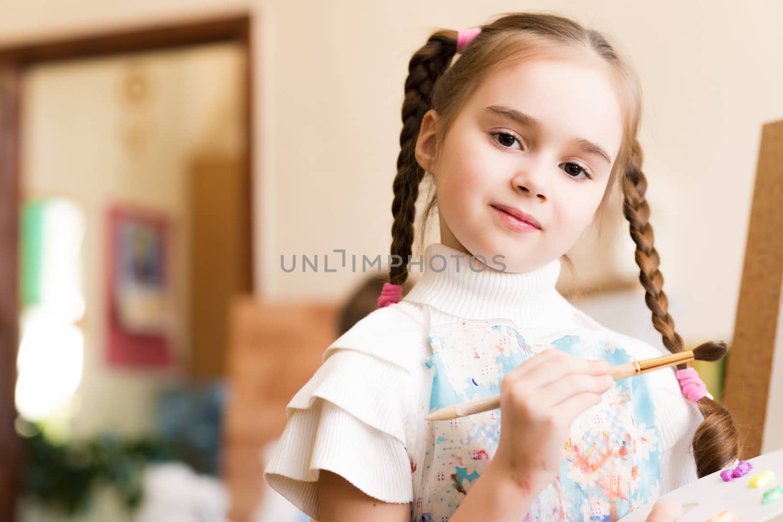 portrait of a girl standing next to his easel, a drawing lesson