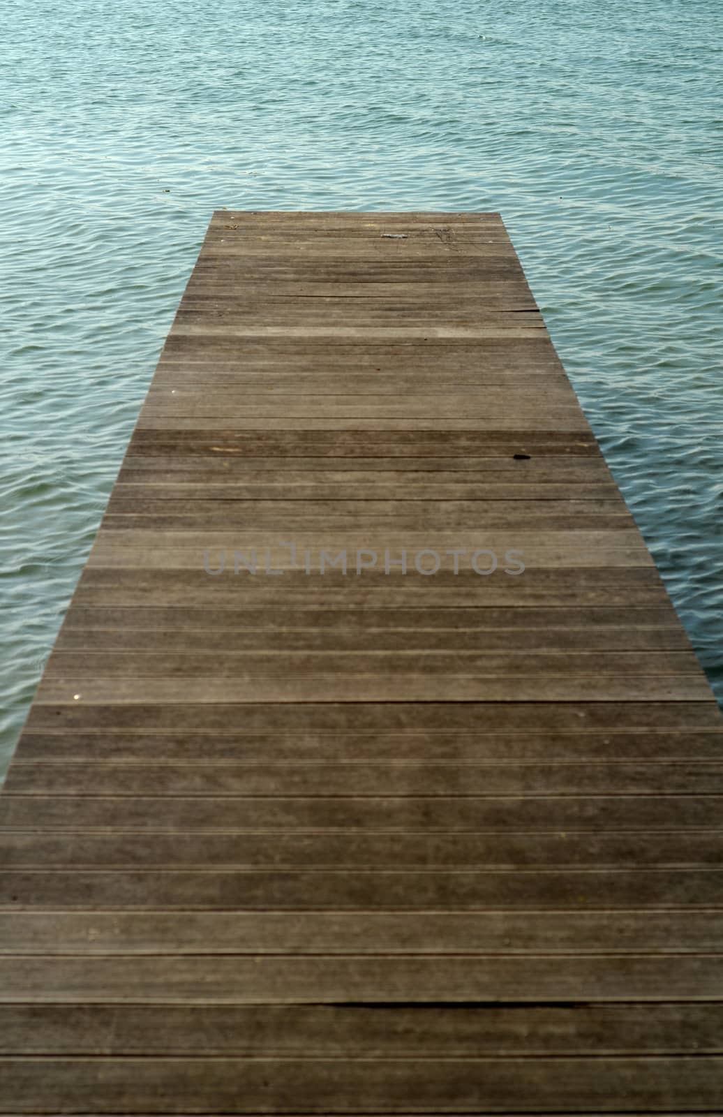 Conceptual Image Of An Empty Pier Into A Lake