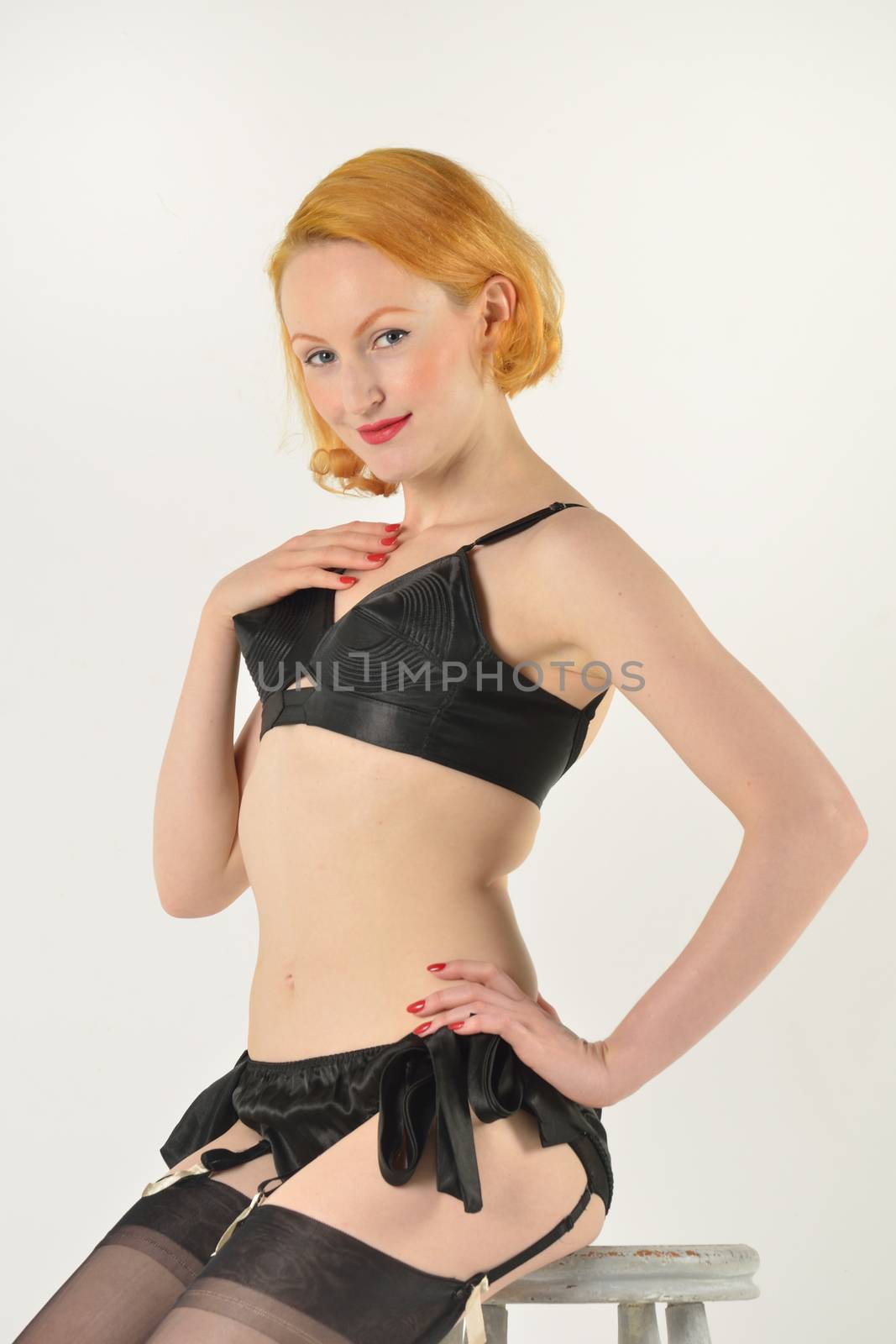 Red head in black underwear sitting on stool