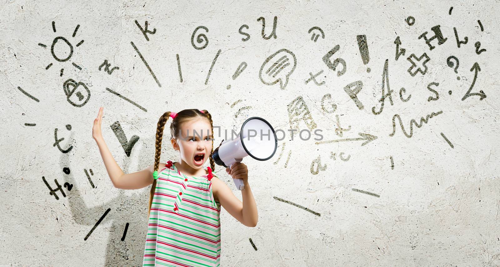 Image of little cute girl screaming angrily in megaphon