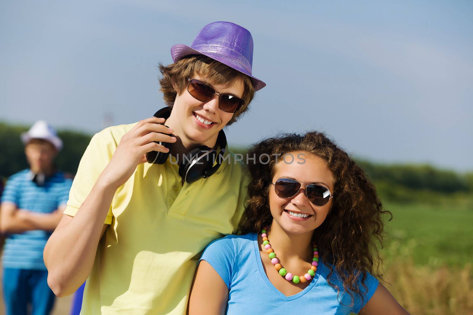 Young man and young woman outdoors. Summer vacation