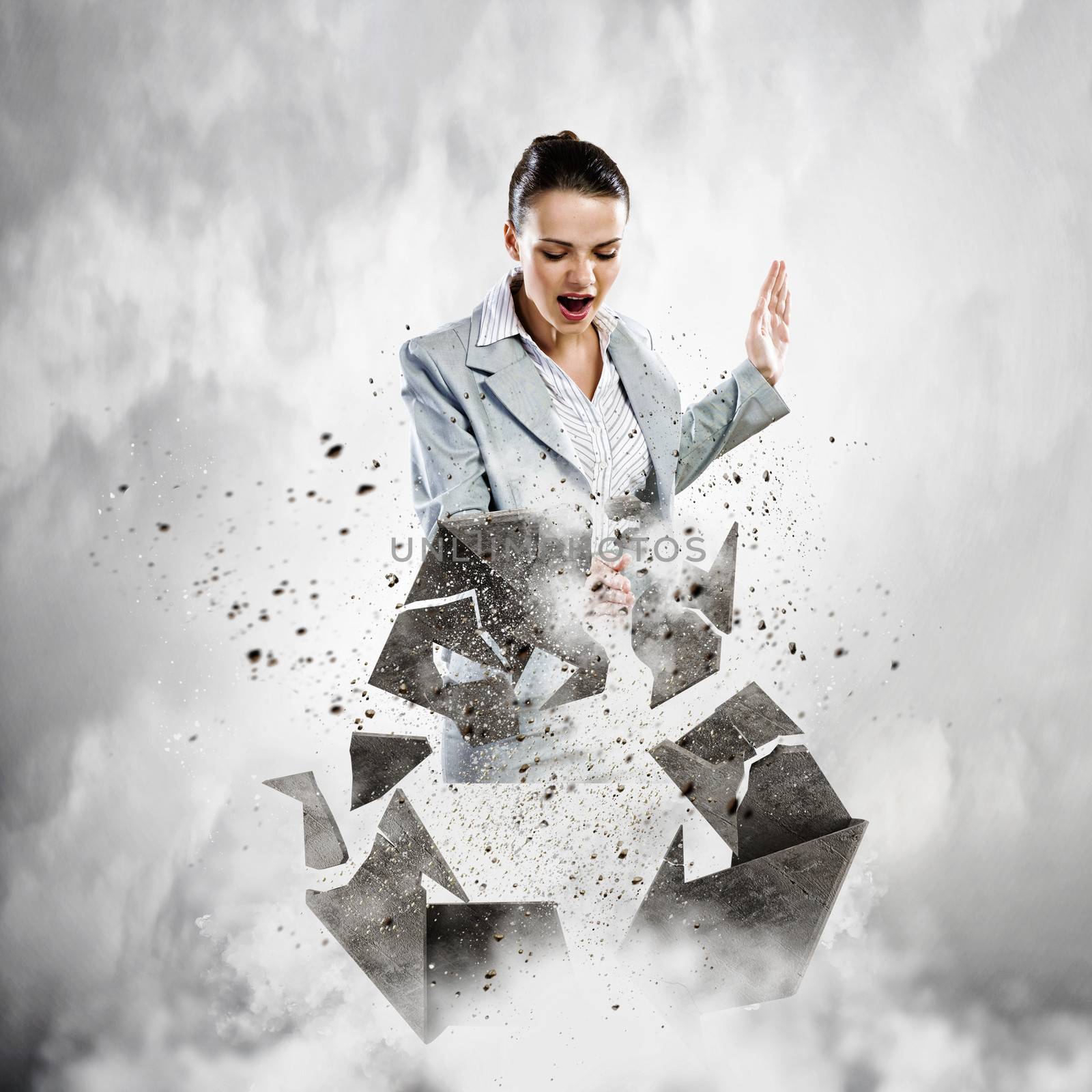 Image of businesswoman crashing recycle stone symbol