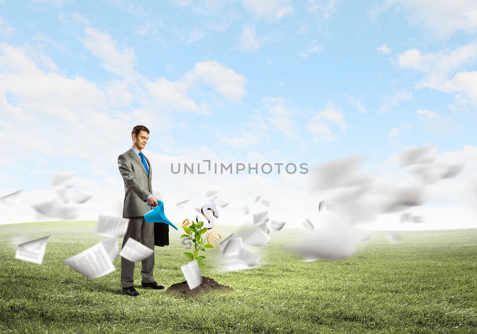 Image of businessman watering money tree with currency symbols