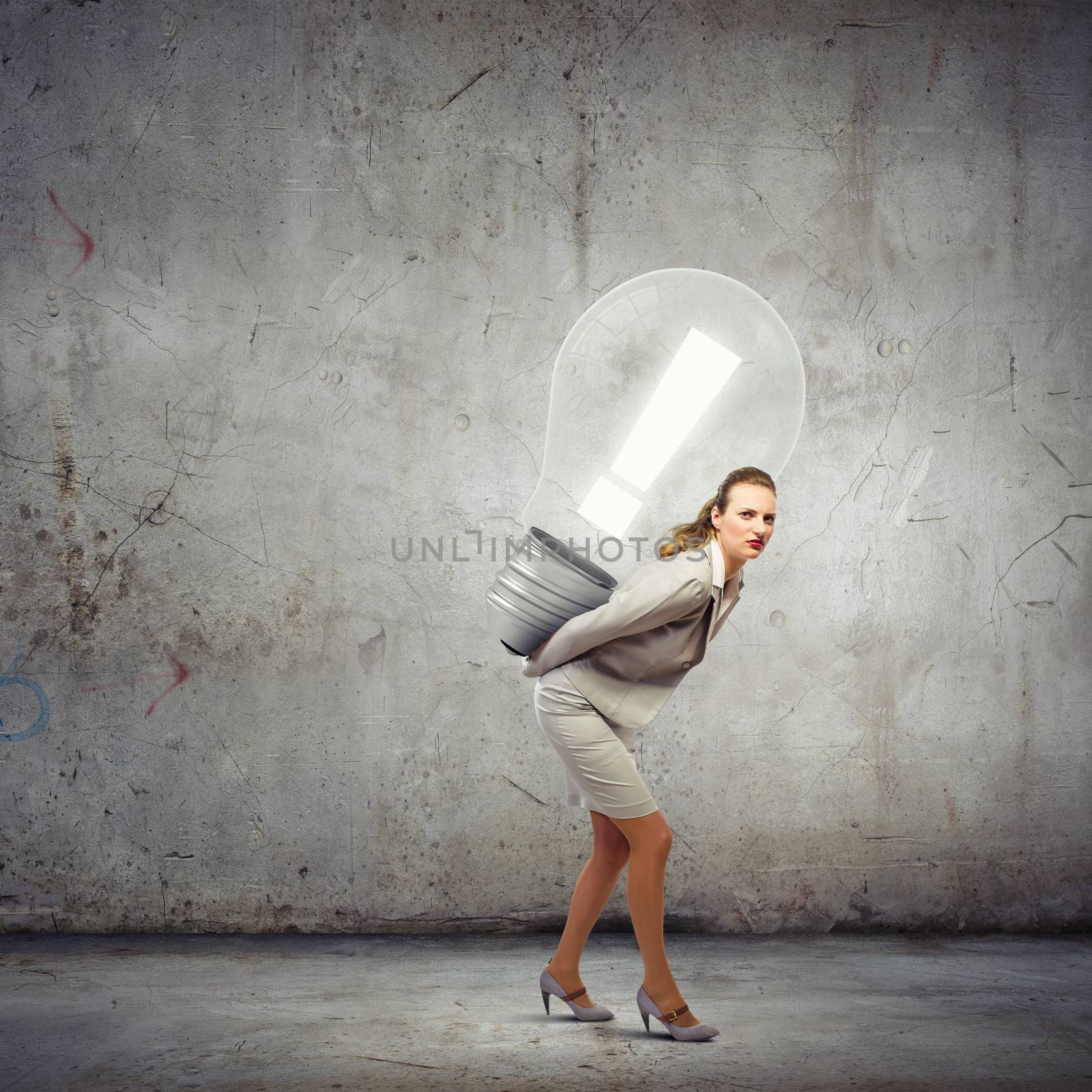 Image of businesswoman holding bulb on back