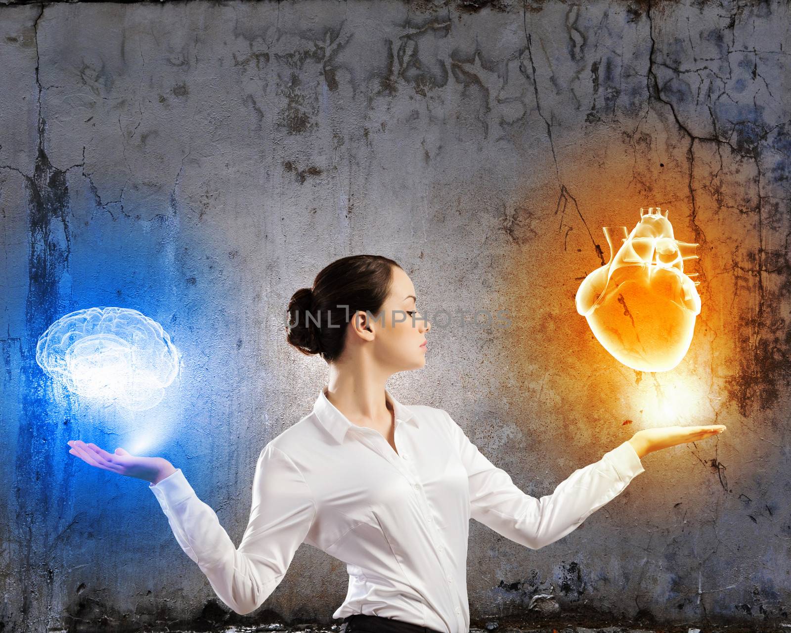 Image of businesswoman balancing with items in palms