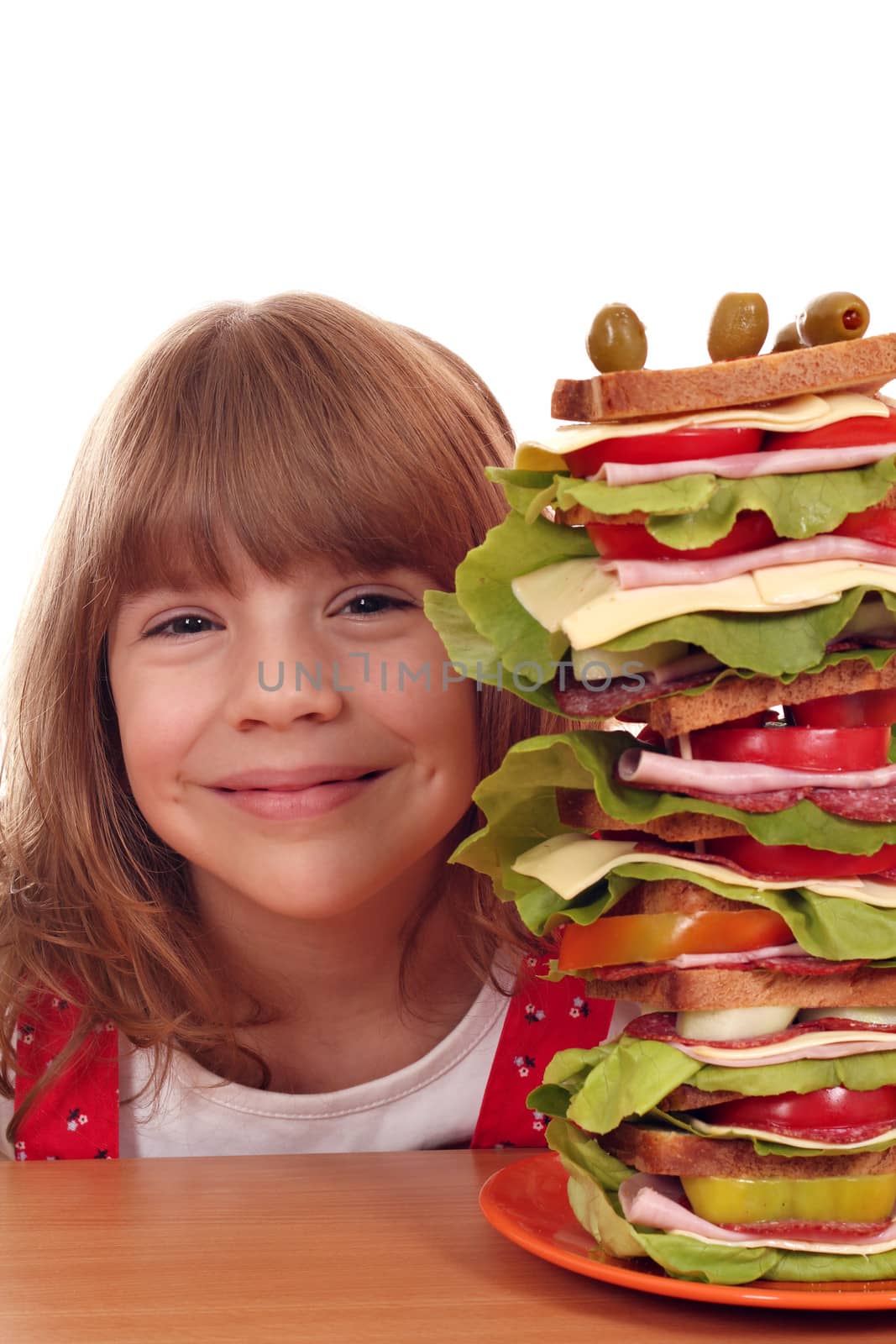 beautiful happy little girl with tall sandwich