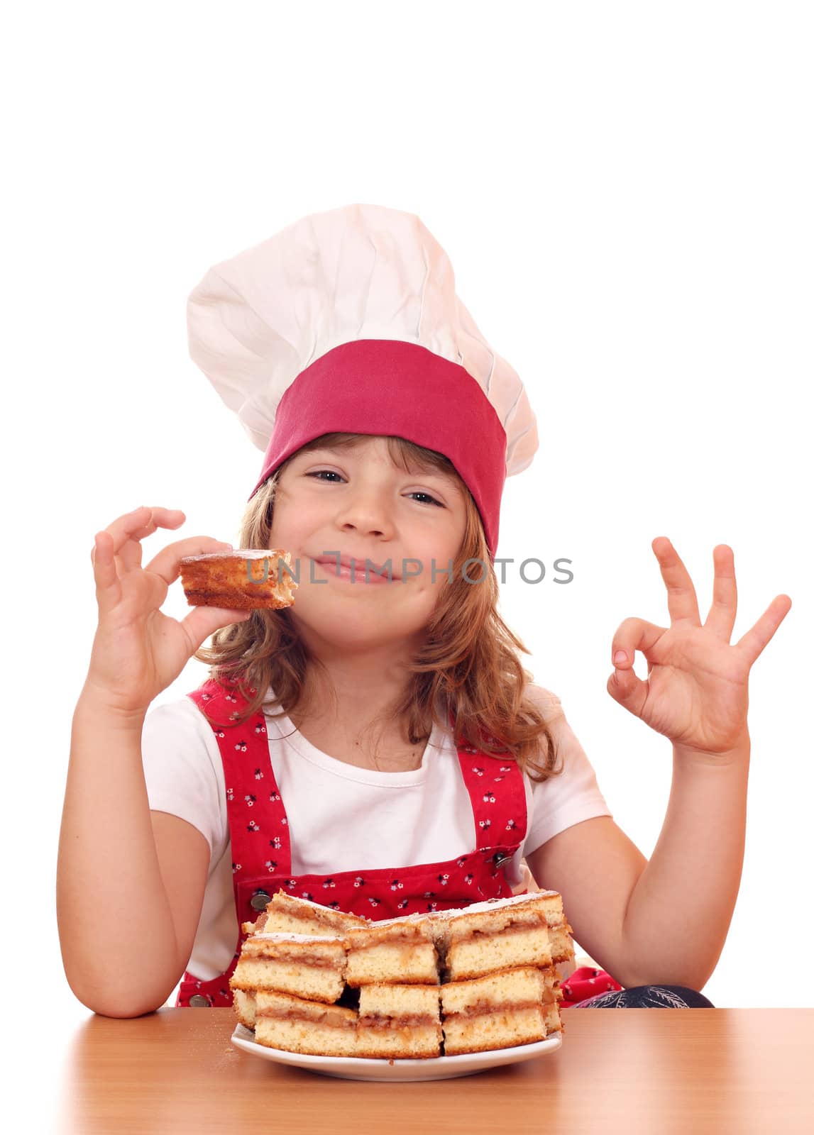 little girl cook with ok hand sign and apple cakes by goce