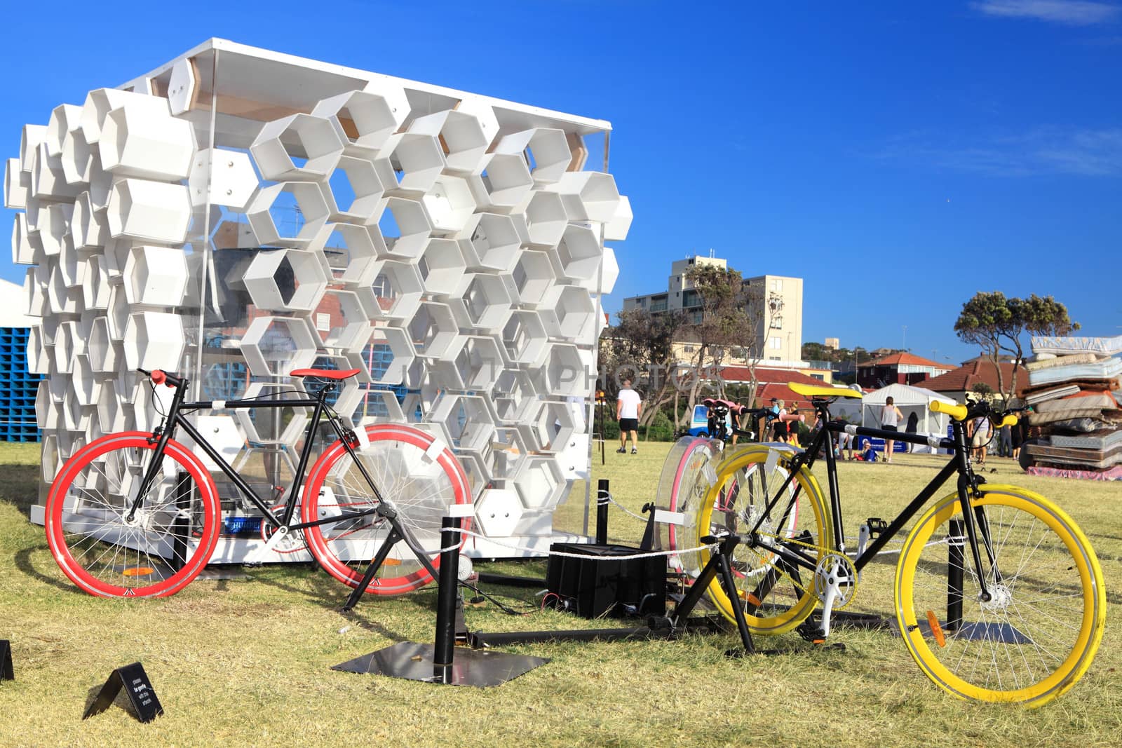 Bondi Beach, Australia - November 3,  2013: Sculpture By The Sea, Bondi 2013. Annual cultural event that showcases emerging artists from around the world  Sculpture titled 'The hive' by Michael Turski  (NSW).  Medium rperspex, corflute, timber, bicycles.  