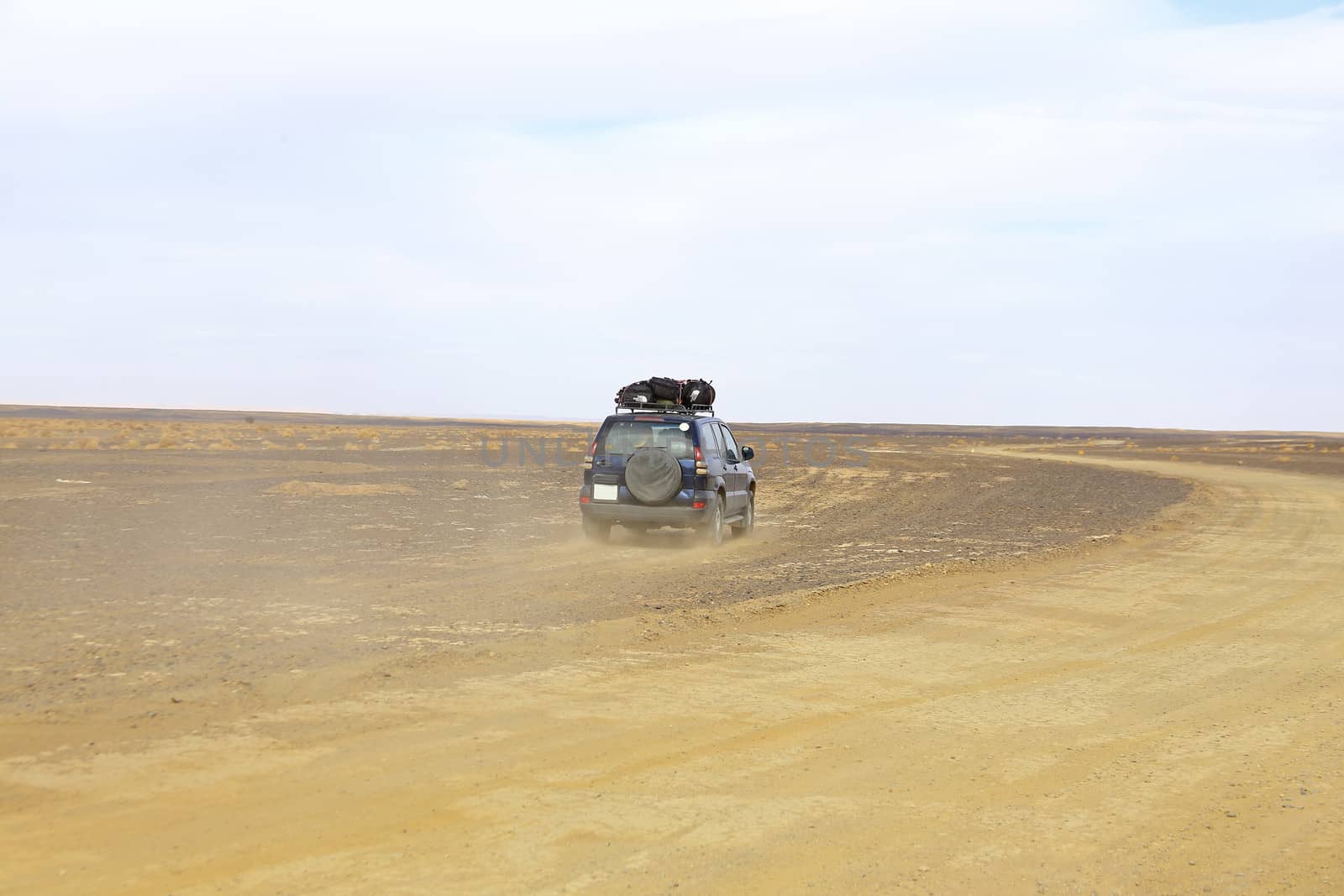 Car driving in the Erg Chebbi desert in Morocco Africa