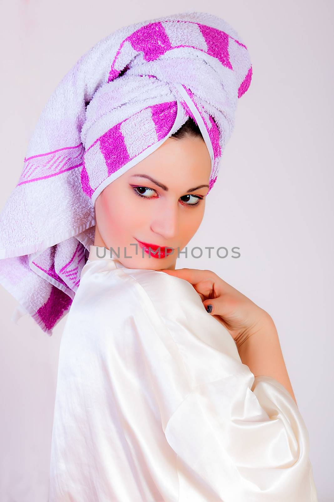 Portrait of attractive girl with towel on her head